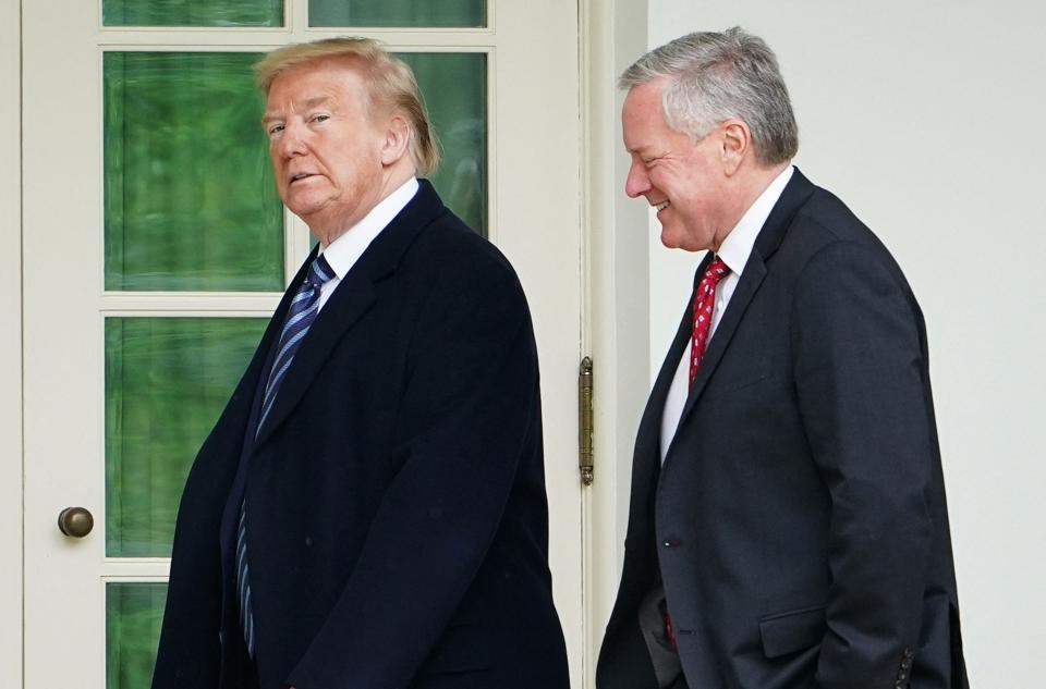 US President Donald Trump walks with Chief of Staff Mark Meadows after returning to the White House from an event at the WWII memorial in Washington, DC, on May 8, 2020. Donald Trump was indicted August 14, 2023 on charges of racketeering and a string of election crimes after a sprawling two-year probe into his efforts to overturn his 2020 defeat to Joe Biden in the US state of Georgia, according to a court filing. The indictment named a number of co-defendants including Trump's former personal lawyer Rudy Giuliani, who pressured local legislators over the result after the election, and Trump's White House chief of staff, Mark Meadows. (Photo by MANDEL NGAN / AFP) (Photo by MANDEL NGAN/AFP via Getty Images)