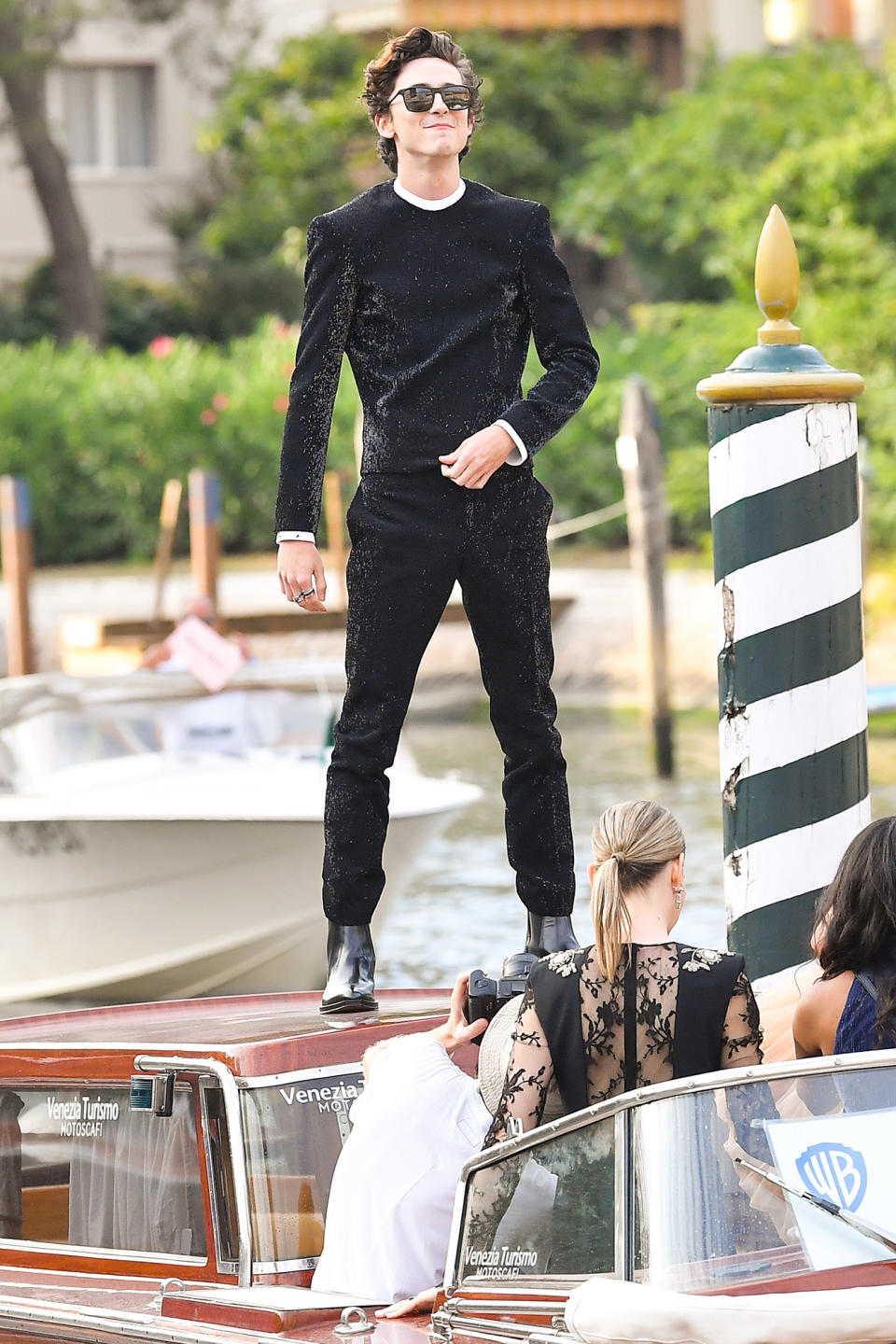 <p>Timothée Chalamet got a bird's-eye view from atop a water taxi while arriving for the screening of <em>Dune </em>on Sept. 3.</p>
