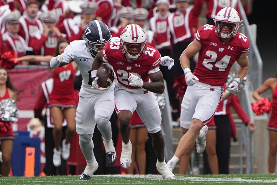 Wisconsin cornerback Jason Maitre (23) returns an interception during the second quarter of their game September 16, 2023 at Camp Randall Stadium in Madison, Wis. Wisconsin beat Georgia Southern 35-14.