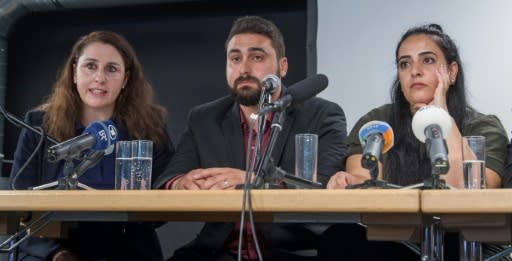 Abdulkerim Simsek (C), son of murdered Enver Simsek, his lawyer Seda Basay (L) and Gamze Kubasik, daughter of murdered Mehmet Kubasik, are among victims' relatives who believe accomplices are still out there