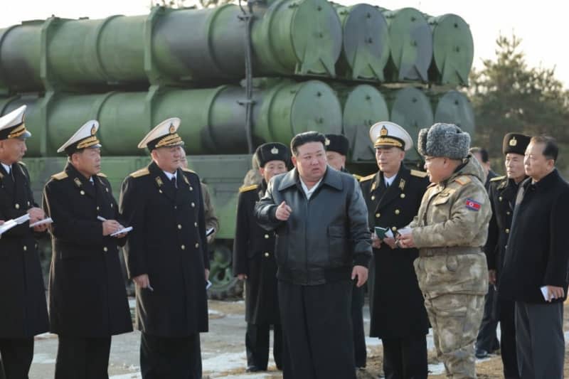 A picture released by the North Korean State News Agency (KCNA) on 15 February 2024 shows North Korean leader Kim Jong Un (C) inspecting the evaluation test fire of the new-type surface-to-sea missile Padasuri-6, to be equipped by the navy, at an undisclosed location in North Korea. -/KCNA via YNA/dpa