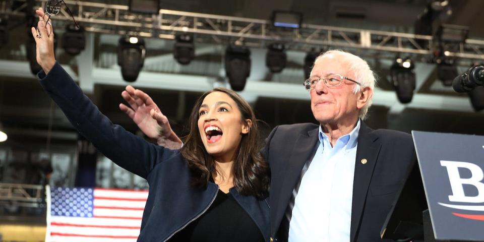 GettyImages U.S. Rep. Alexandria Ocasio-Cortez (D-N.Y) and Democratic presidential candidate Sen. Bernie Sanders (I-VT) stand together during his campaign event at the Whittemore Center Arena on February 10, 2020 in Durham, New Hampshire.