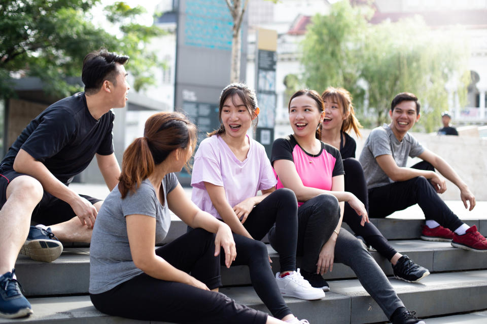 A group of Asian-American students sitting together and talking