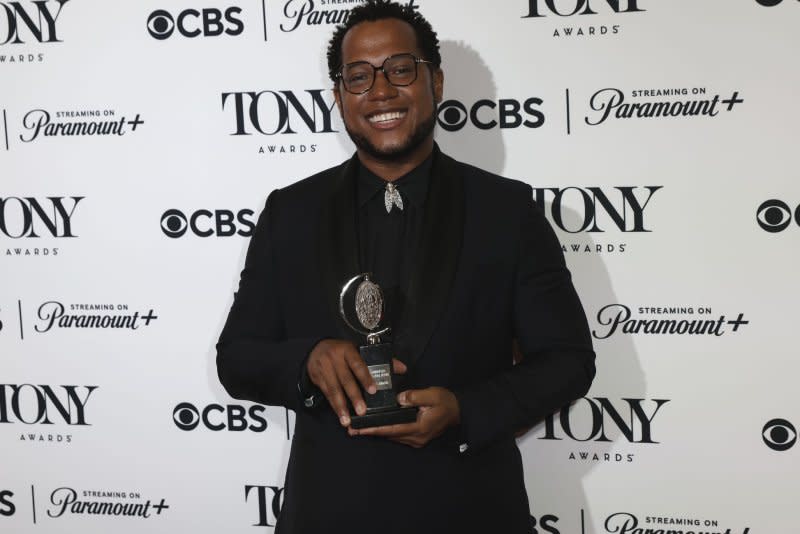 Branden Jacobs Jenkins, winner of the Best Revival of a Play award for "Appropriate," holds his Tony Award in the press room at the David H. Koch Theater at Lincoln Center for the Performing Arts on Sunday in New York City. Photo by Peter Foley/UPI