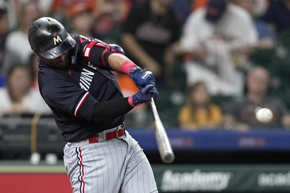 Minnesota Twins' Donovan Solano hits a two-run single against the Houston Astros during the third inning of a baseball game Wednesday, May 31, 2023, in Houston. (AP Photo/David J. Phillip)