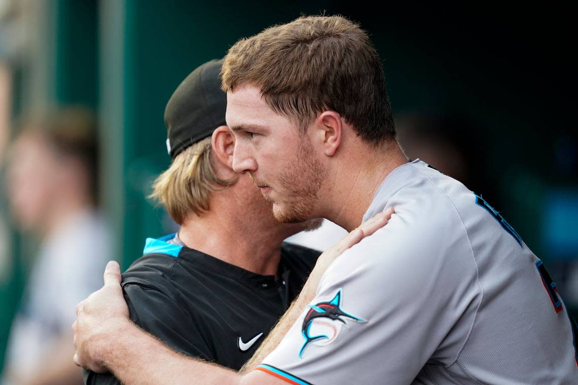 Miami Marlins pitching coach Mel Stottlemyre, left, and starting pitcher Trevor Rogers talk in the dugout after Rogers pitched through the fifth inning of the team’s baseball game against the Washington Nationals at Nationals Park, Friday, July 1, 2022, in Washington. (AP Photo/Alex Brandon)