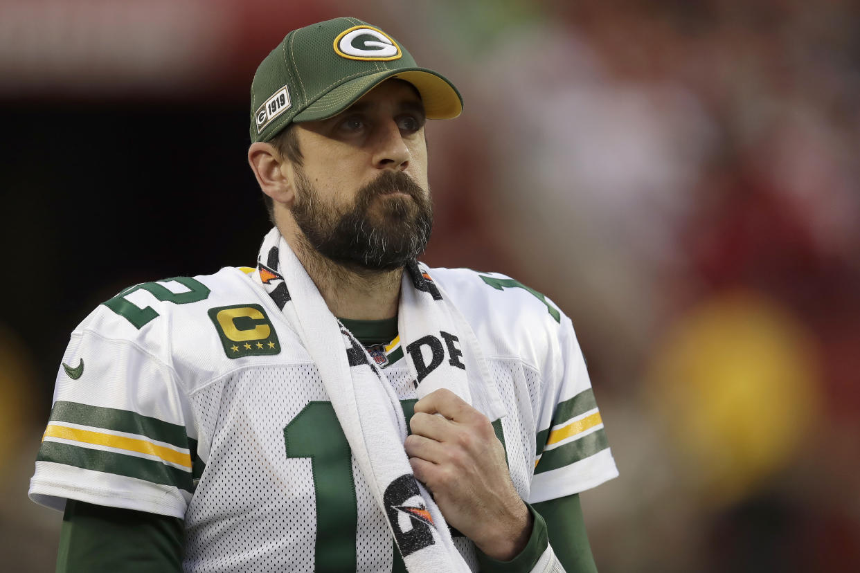 FILE - In this Jan. 19, 2020, file photo, Green Bay Packers quarterback Aaron Rodgers (12) watches from the sideline during the first half of the NFL NFC Championship football game against the San Francisco 49ers in Santa Clara, Calif.  Some players surely flourished and others most certainly floundered when the COVID-19 crisis forced teams to replace their regular offseason programs with virtual OTAs and videoconference. (AP Photo/Ben Margot, File)