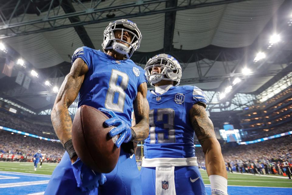 Detroit Lions wide receiver Josh Reynolds (8) celebrates a touchdown against Tampa Bay Buccaneers with running back Craig Reynolds (13) during the first half of the NFC divisional round at Ford Field in Detroit on Sunday, Jan. 21, 2024.