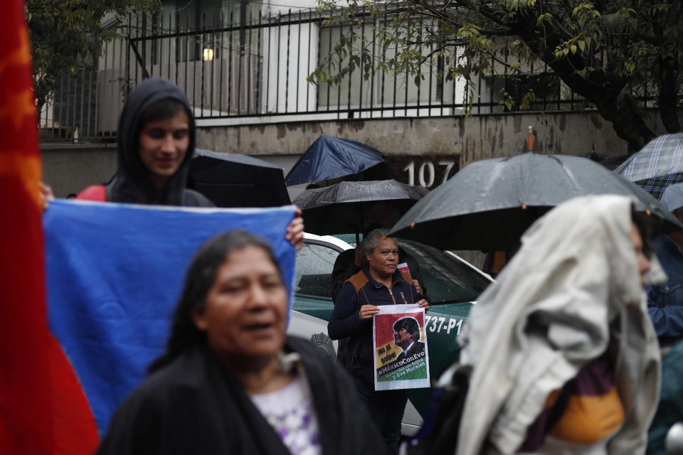 Bolivians and supporters of former President Evo Morales protest in front of the Bolivian embassy in Mexico City, Monday, Nov. 11, 2019. Marcelo Ebrard, the Mexican foreign minister, said Monday, Mexico granted asylum to Morales after his Nov. 10 resignation. (AP Photo / Eduardo Verdugo)