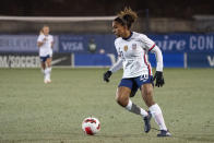 FILE - Unites States forward Catarina Macario (20) dribbles the ball during the first half of a She Believes Cup soccer match against Iceland, Wednesday, Feb. 23, 2022 in Frisco, Texas. Macario says she won't be ready in time to play for the United States in this summer's Women's World Cup as she recovers from an ACL injury. (AP Photo/Jeffrey McWhorter, File)