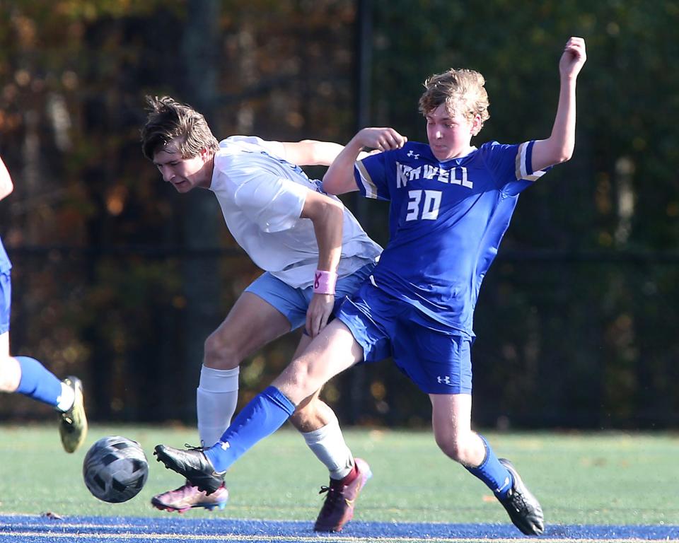 Norwell's Ben Garland and East Bridgewater's Zachary Higgins battle for the ball during a Round of 32 game in the Division 3 state tournament at the Norwell Clipper Community Complex on Saturday, Nov. 5, 2022. Norwell would go on to win, 3-0.
