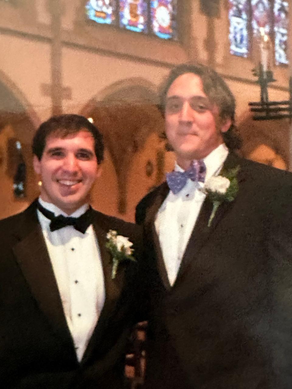 Battle Ground Academy football coach Jonas Rodriguez, left, and his best man, Vanderbilt general manager Barton Simmons, during Rodriguez's wedding in 2008.