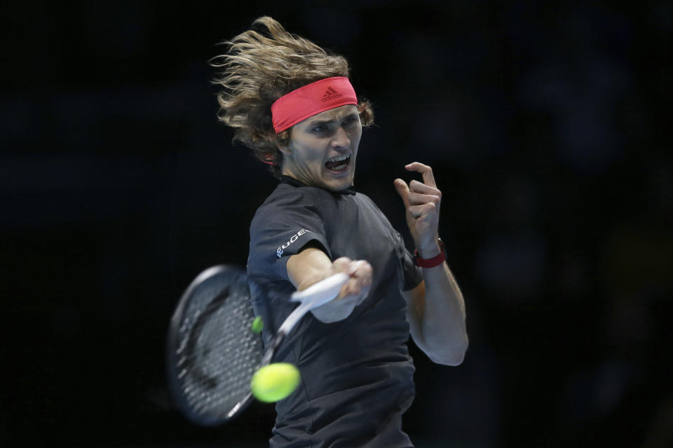 Alexander Zverev of Germany plays a return to Roger Federer of Switzerland in their ATP World Tour Finals singles tennis match at the O2 Arena in London, Saturday Nov. 17, 2018. (AP Photo/Tim Ireland)