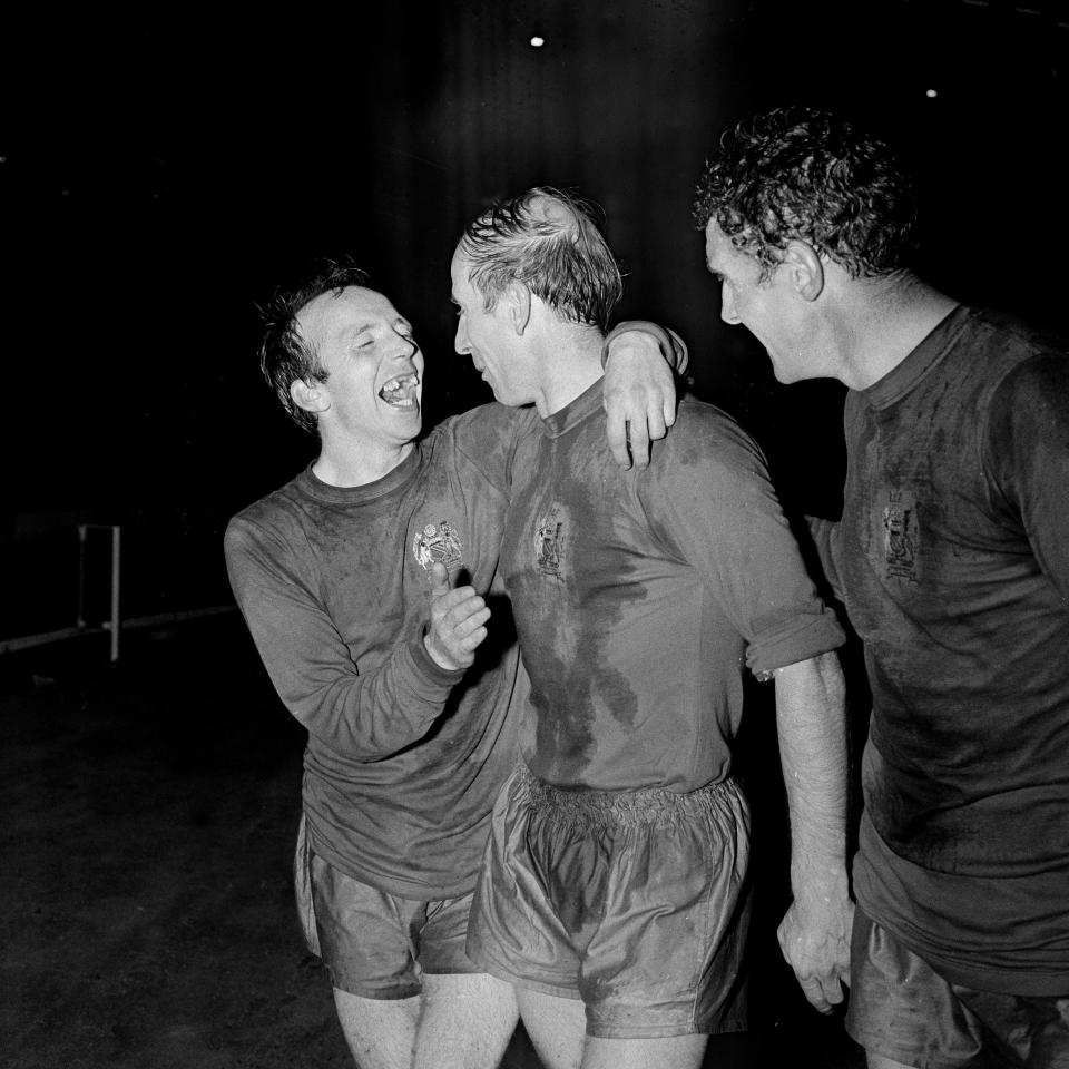 Stiles hugs Bobby Charlton ( with Bill Foulkes, right) as Manchester United celebrate victory over Benfica in the 1968 European Cup Final - Popperfoto/Getty Images