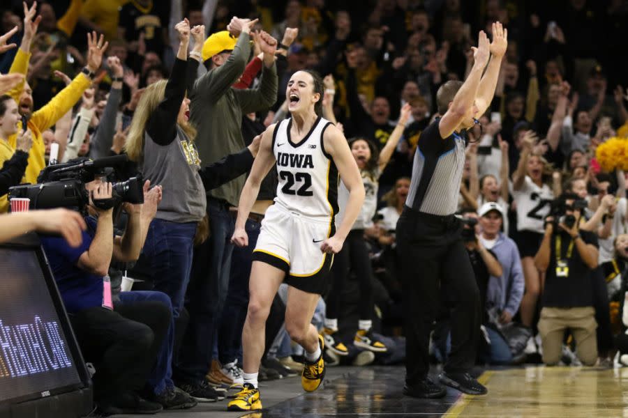 Caitlin Clark #22 of the Iowa Hawkeyes celebrates after breaking the NCAA women’s all-time scoring record during the first half against the Michigan Wolverines at Carver-Hawkeye Arena on February 15, 2024 in Iowa City, Iowa. (Photo by Matthew Holst/Getty Images)