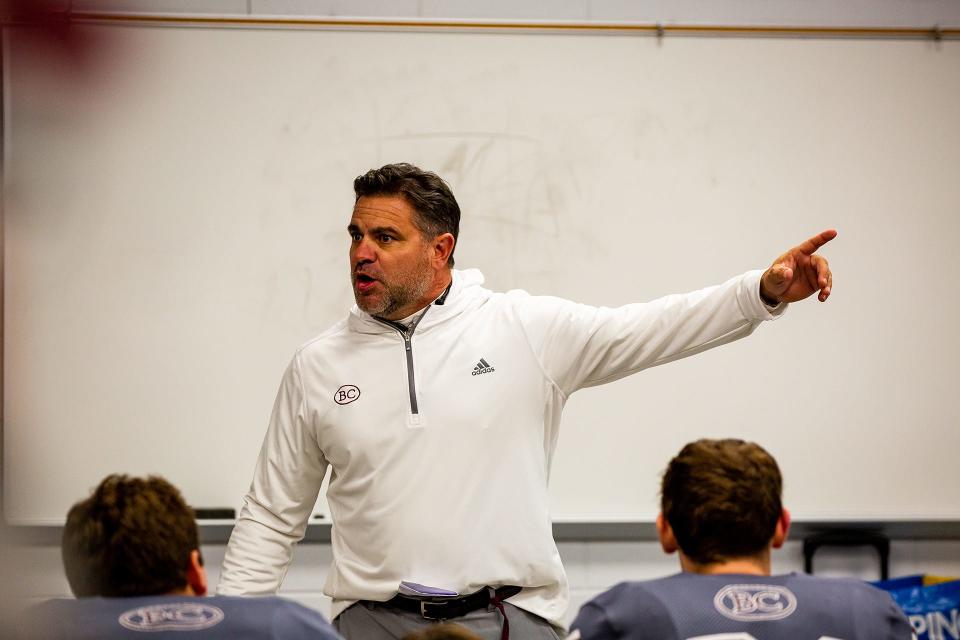 Benedictine football coach Danny Britt gives the team a motivational speech before the state quarterfinal game against Marist on Nov. 26, 2021 at Memorial Stadium.