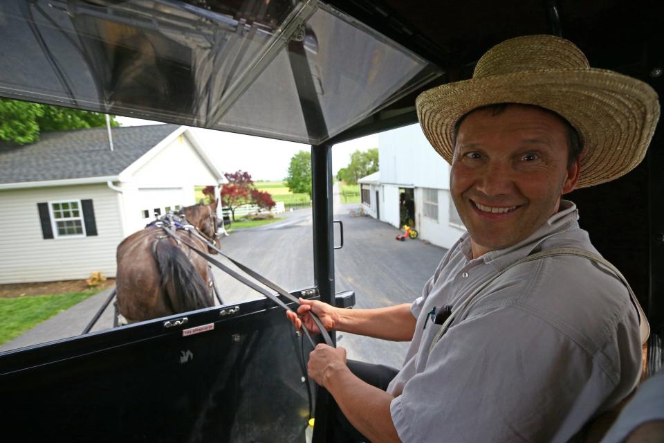 A man rides an Amish horse in a buggy in Central Pennsylvania, United States on April 30, 2017.