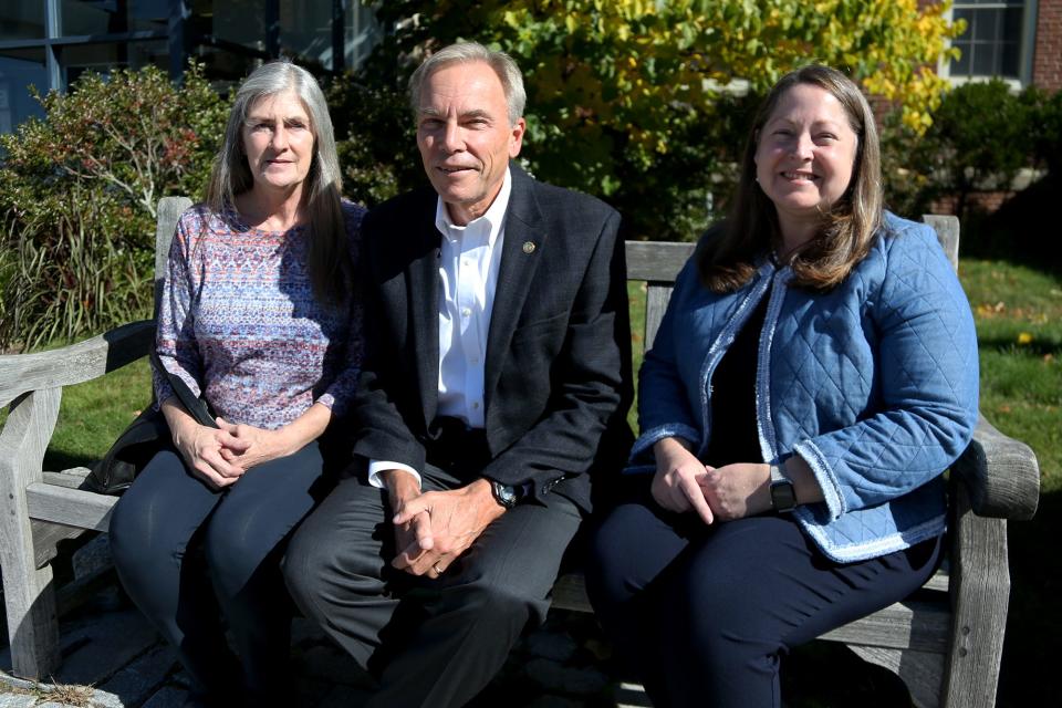 Portsmouth Energy Advisory Committee member Allison Tanner, left, City Councilor John Tabor and City Councilor Kate Cook discuss plans for the city's involvement with the Community Power Coalition of New Hampshire Tuesday, Oct. 11, 2022 in front of City Hall.