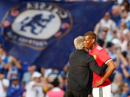 Soccer Football - FA Cup Final - Chelsea vs Manchester United - Wembley Stadium, London, Britain - May 19, 2018 Manchester United manager Jose Mourinho consoles Paul Pogba after the match REUTERS/Andrew Yates