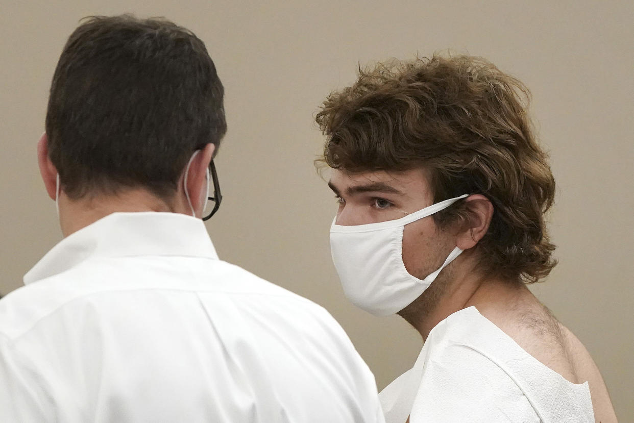 Payton Gendron talks with his attorney during his arraignment in Buffalo City Court, Saturday, May 14, 2022, in Buffalo, N.Y. (Mark Mulville/The Buffalo News via AP)