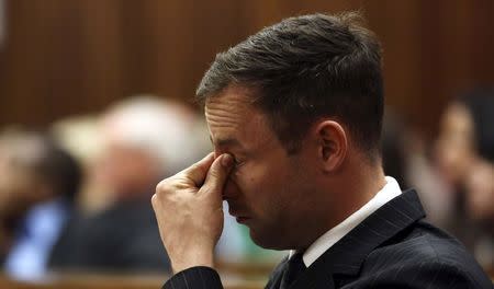 Olympic and Paralympic track star Oscar Pistorius attends his sentencing hearing at the North Gauteng High Court in Pretoria October 14, 2014. REUTERS/Themba Hadebe/Pool