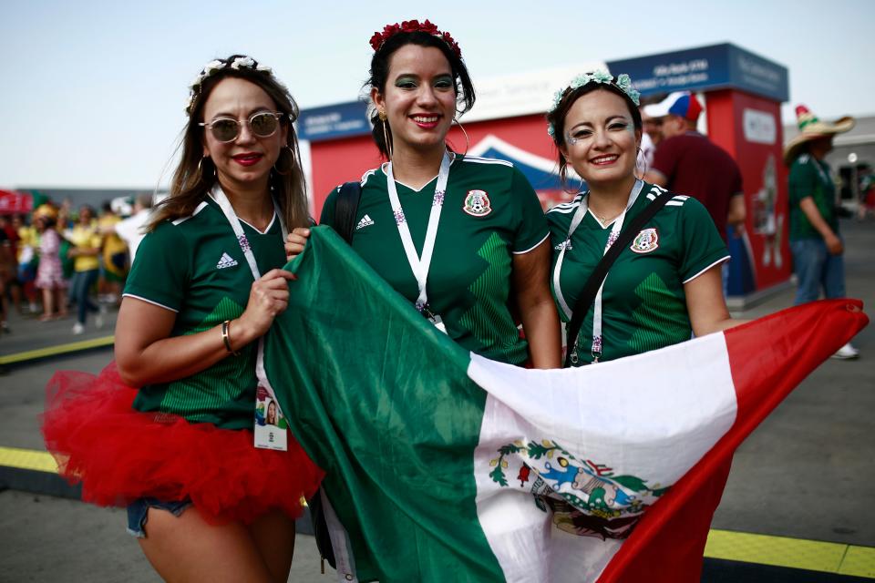 <p>Mexico fans pose before the Russia 2018 World Cup round of 16 football match between Brazil and Mexico at the Samara Arena in Samara on July 2, 2018. (Photo by Benjamin CREMEL / AFP) </p>