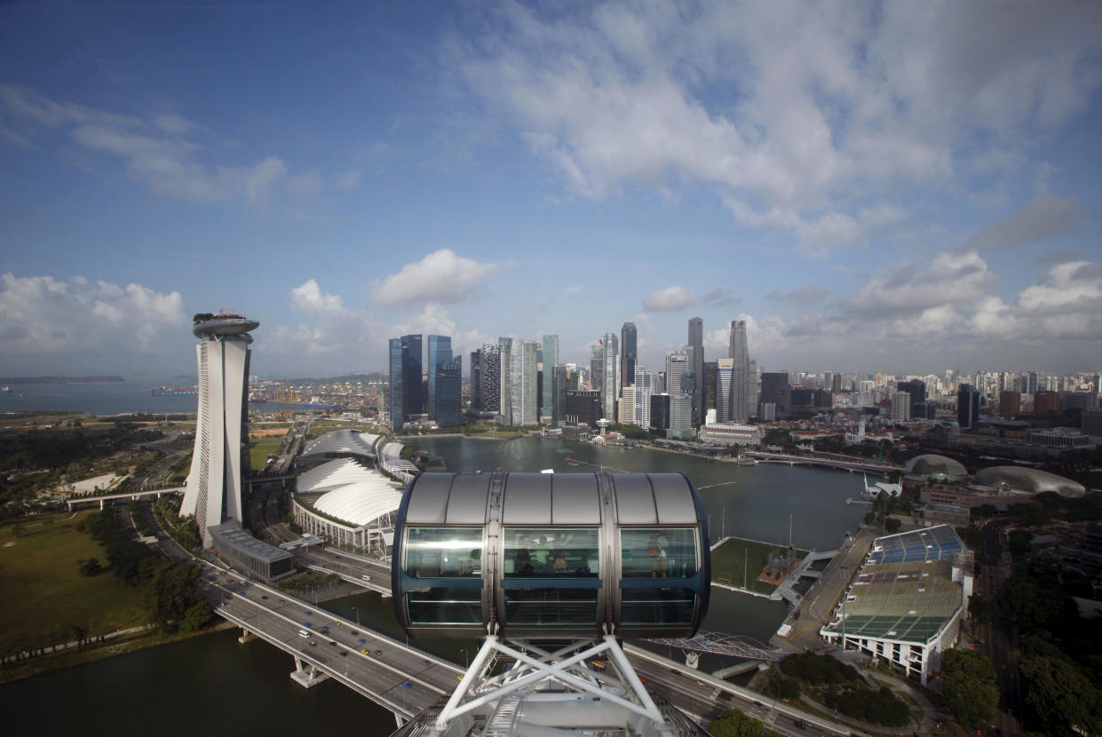 File photo of the Singapore Flyer observatory wheel overlooking the skyline of the central business district in Singapore. REUTERS/Edgar Su