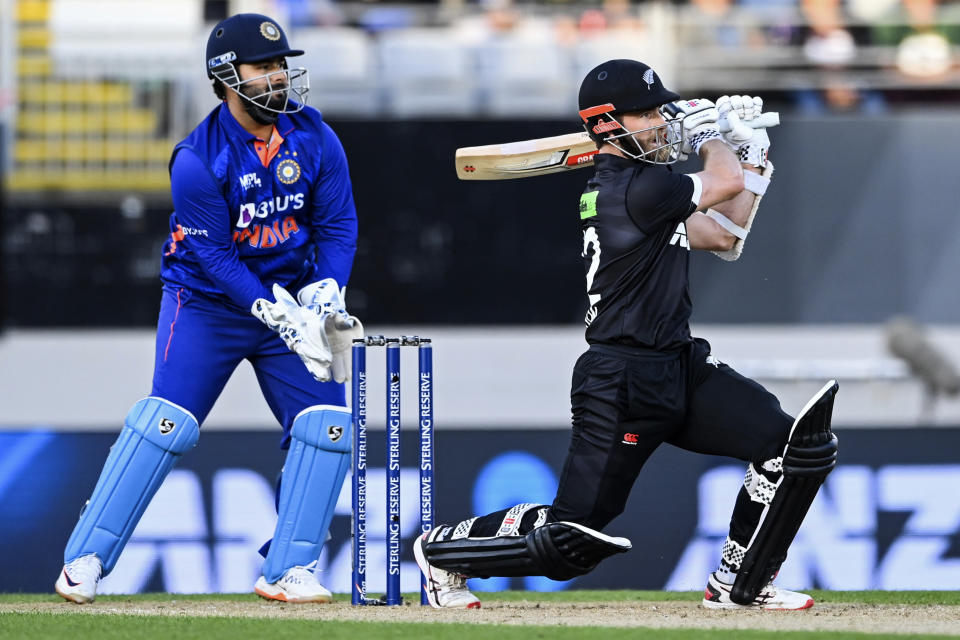New Zealand Kane Williamson, right, bats in front of India wicketkeeper Rishab Pant during their one day international cricket match in Auckland, New Zealand, Friday, Nov. 25, 2022. (Andrew Cornaga/Photosport via AP)
