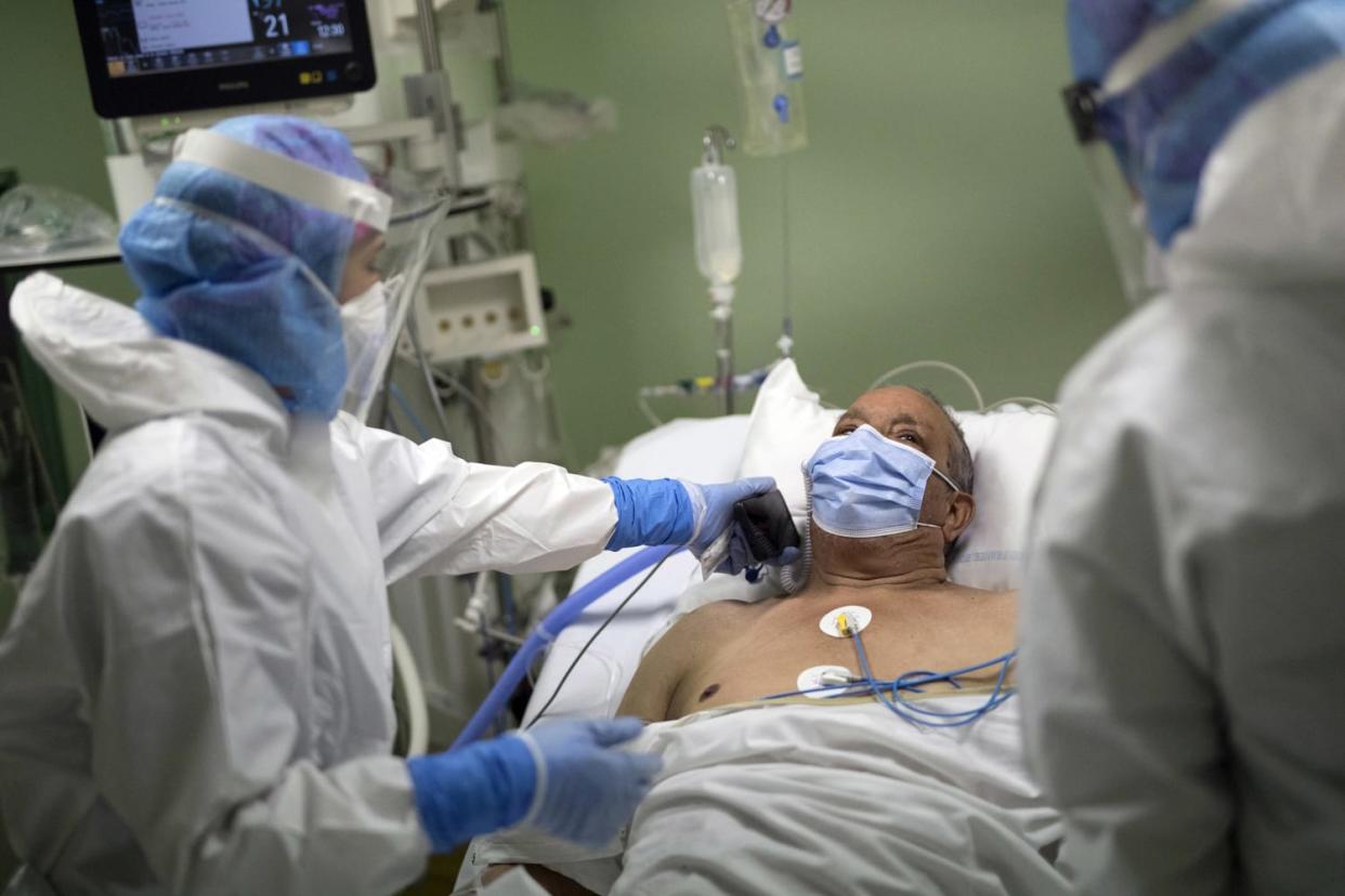 Image: A patient at the Joseph Imbert Hospital Center in Arles, southern France (Daniel Cole / AP)