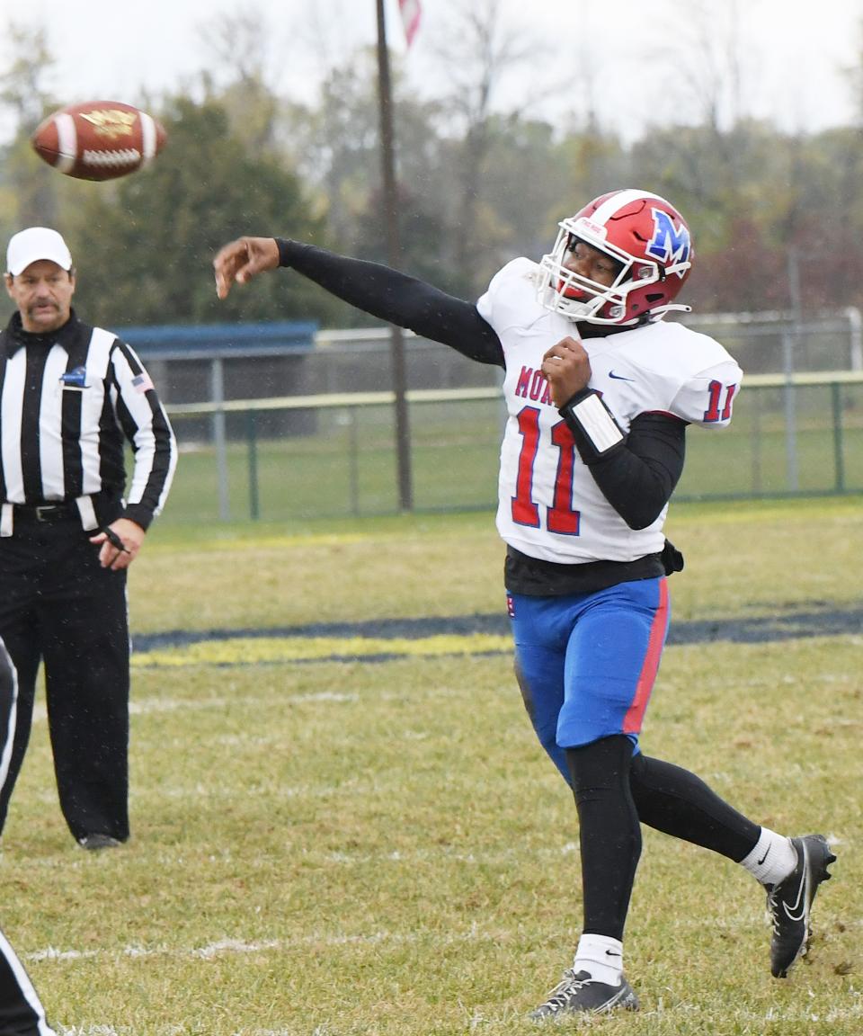 Khaya Moses of Monroe fires a touchdown pass to teammate Amari Colon during the Red Jackets' 48-0 win over Wayne.