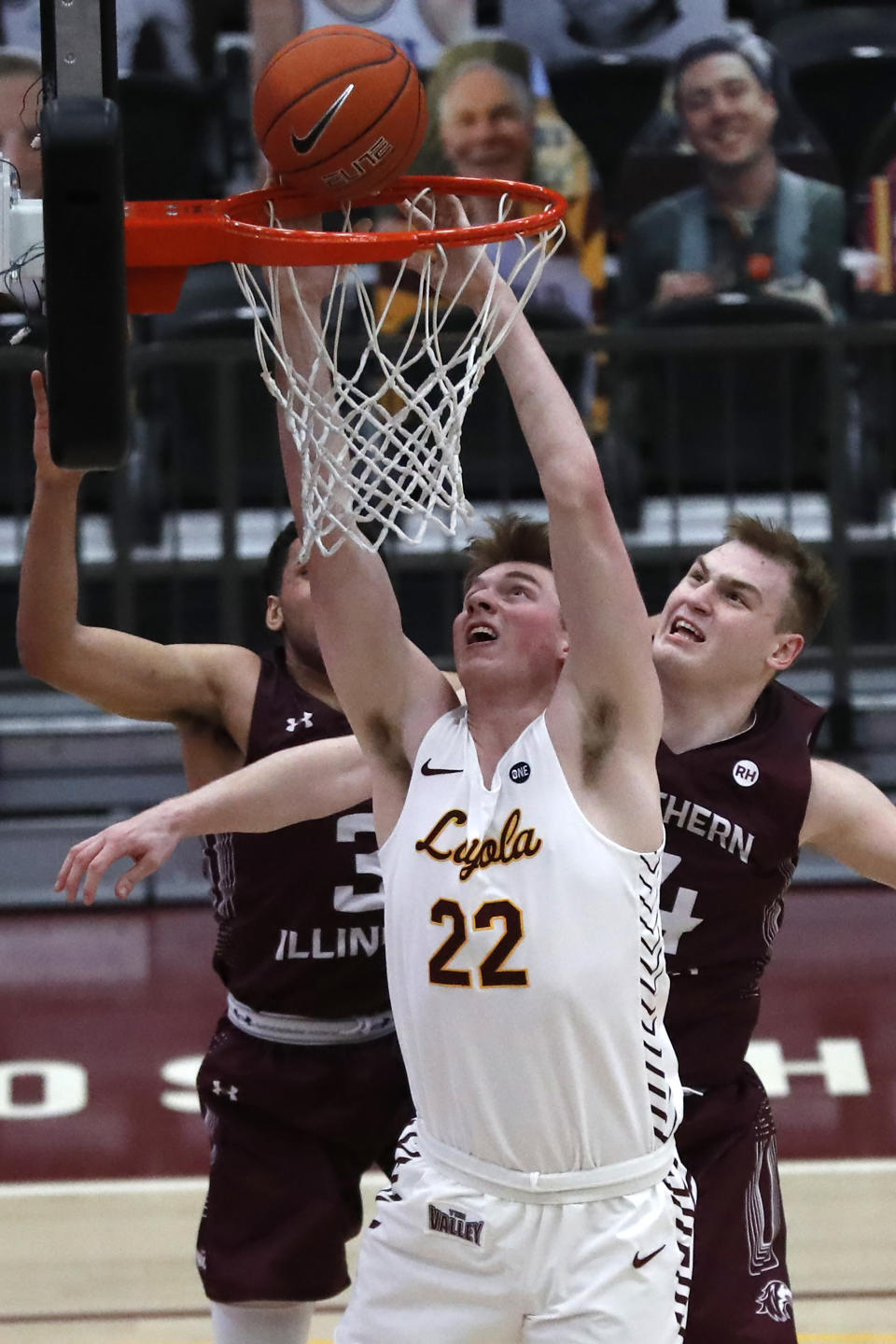 Loyola Chicago center Jacob Hutson (22) shoots over Southern Illinois' Kyler Filewich, right, during the second half of an NCAA college basketball game Friday, Feb. 26, 2021, in Chicago. (AP Photo/Shafkat Anowar)