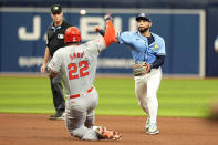 Tampa Bay Rays shortstop Jose Caballero forces Los Angeles Angels' Miguel Sano (22) at second base and relays the throw to first to turn a double play on Mickey Moniak during the fourth inning of a baseball game Thursday, April 18, 2024, in St. Petersburg, Fla. (AP Photo/Chris O'Meara)