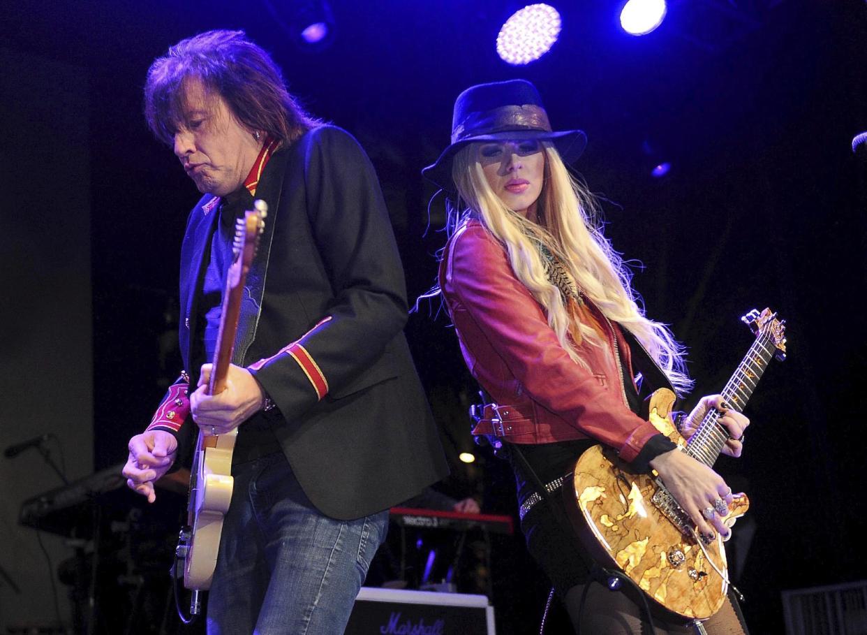 Richie Sambora and Orianthi perform at the NAMM convention in Anaheim, Calif., Thursday, Jan. 19, 2017. (Bill Alkofer/The Orange County Register via AP)