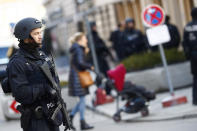 A police officer secures the area around the Hotel 'Bayerischer Hof' at the first day of the International Security Conference in Munich, Germany, Friday, Feb. 15, 2019. (AP Photo/Matthias Schrader)