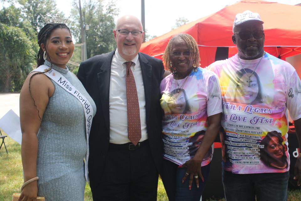 Pictured from left to right: Miss Florida Gator 2023 Imari Harris; Gainesville Mayor Harvey Ward; Twila Robinson-Browder's mother, Felicia Carnegie-Parker; and Larry Parker, Carnegie-Parker’s husband. They posed for a picture during the Twila Love Fest at T.B. McPherson Park on Saturday (Aug. 26,2023.)