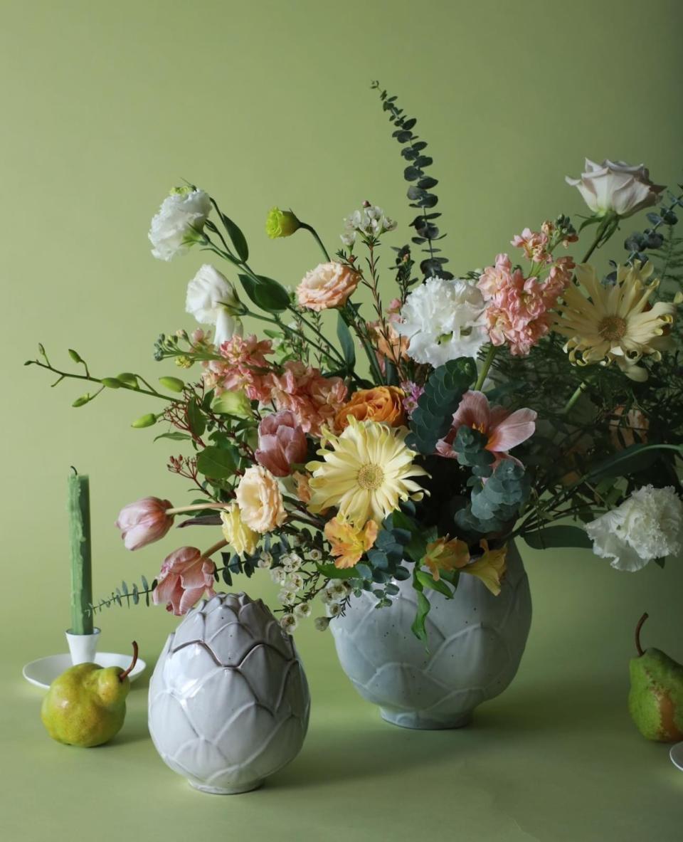 Vases with floral arrangements by Charlotte Puxley