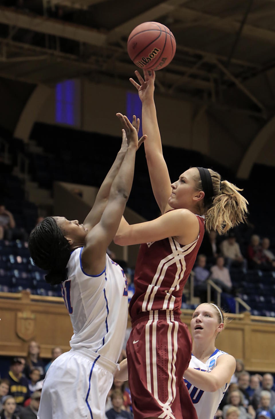 Oklahoma's Nicole Kornet shoots over DePaul's Jasmine Penny during the first half of their first-round game in the NCAA basketball tournament in Durham, N.C., Saturday, March 22, 2014. (AP Photo/Ted Richardson)