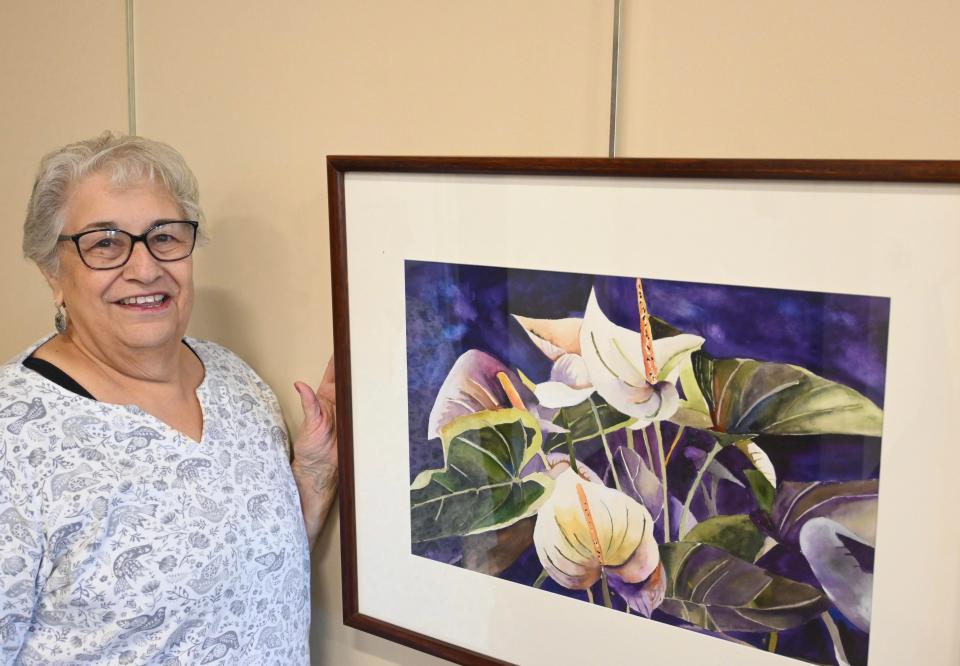 Hampstead artist Dannielle Genovese stands with one of her pieces of artwork that will be sold at the “Fuel for Vets” auction at the Kingston Community Library on Oct. 16.
