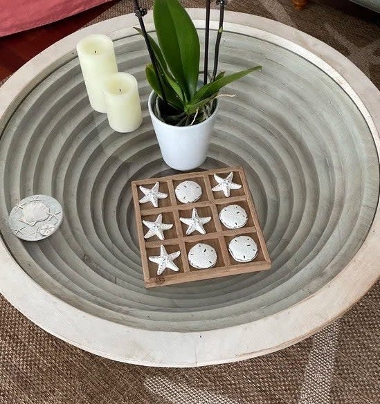 A reviewer photo of the tic-tac-toe set on a table