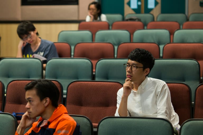 Aged 23, Nathan Law (R) is Hong Kong's youngest-ever lawmaker