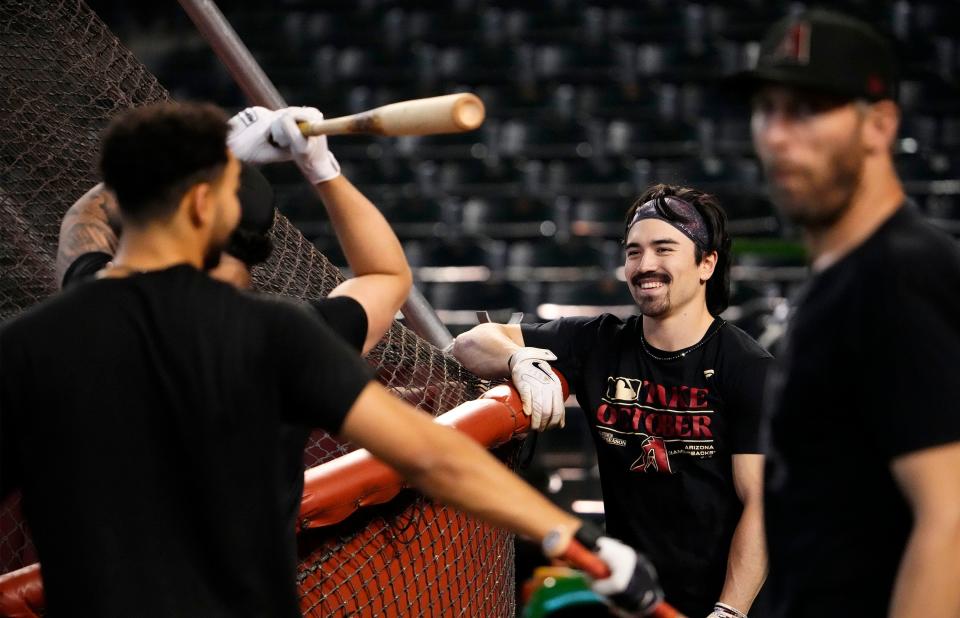 Diamondbacks right fielder Corbin Carroll takes a moment during workouts at Chase Field on Friday for their upcoming NLCS matchup against the Philadelphia Phillies.