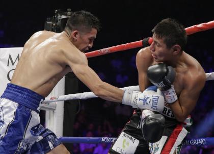 Leo Santa Cruz, left, lands against Jose Cayetano during their May 2 bout. (AP)