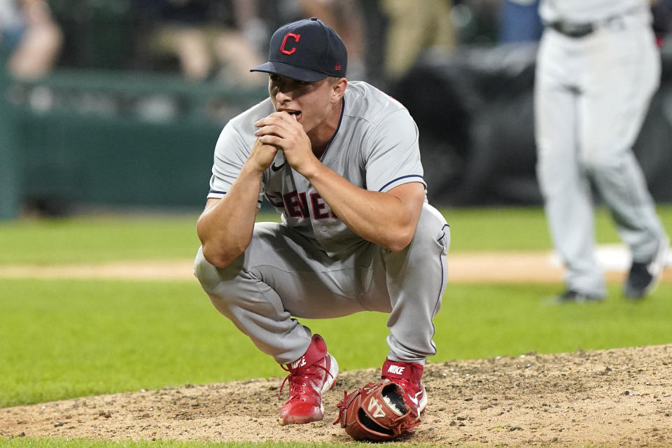 Cleveland Indians relief pitcher James Karinchak reacts after he hit Chicago White Sox's Jose Abreu with a pitch during the eighth inning of a baseball game in Chicago, Friday, July 30, 2021. (AP Photo/Nam Y. Huh)