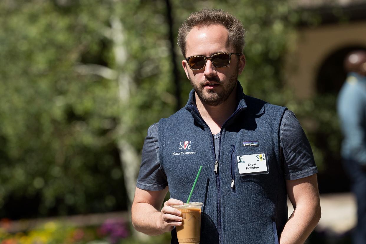 Drew Houston walking with iced coffee