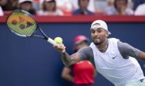 Nick Kyrgios of Australia returns to Daniil Medvedev during second round play at the National Bank Open tennis tournament Wednesday Aug. 10, 2022. in Montreal. (Paul Chiasson/The Canadian Press via AP)