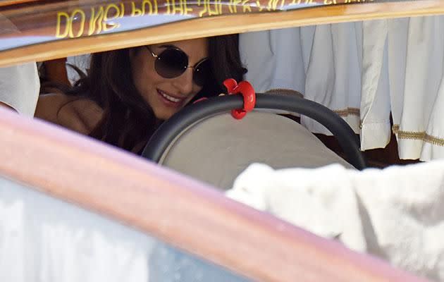 Amal could be seen sitting near her children in the boat. Source: SPLASH