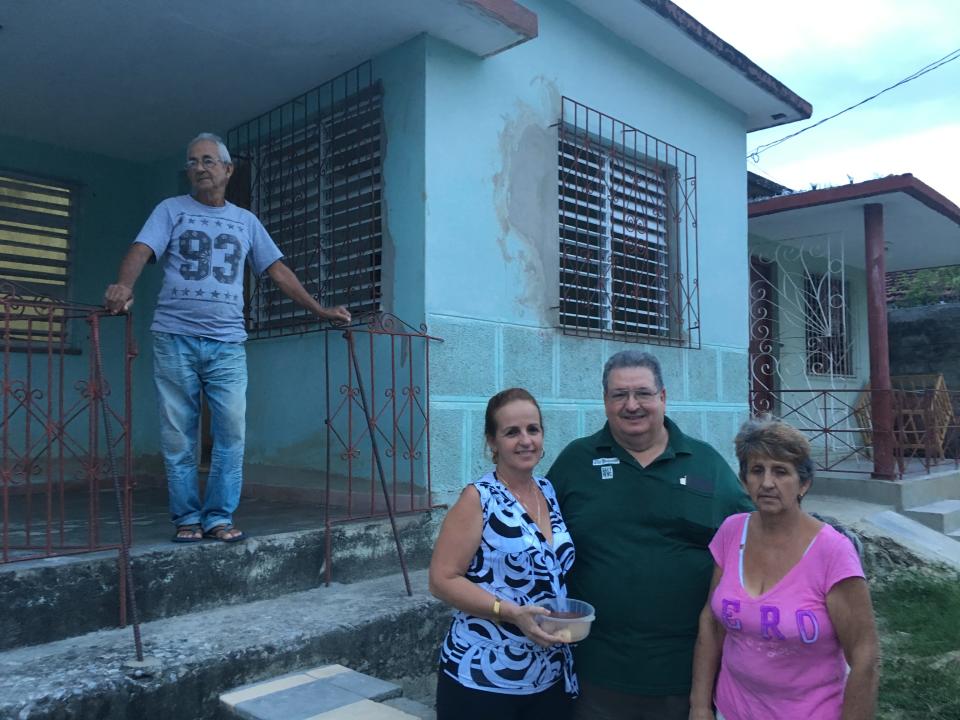 My dad, Ed Delfin, center, is reunited with his cousins after 50 years apart.