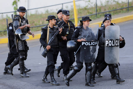 Riot police stand guard in front of 100% Noticias Channel building after its director Miguel Mora was arrested by national police in Managua, Nicaragua December 22, 2018.REUTERS/Oswaldo Rivas