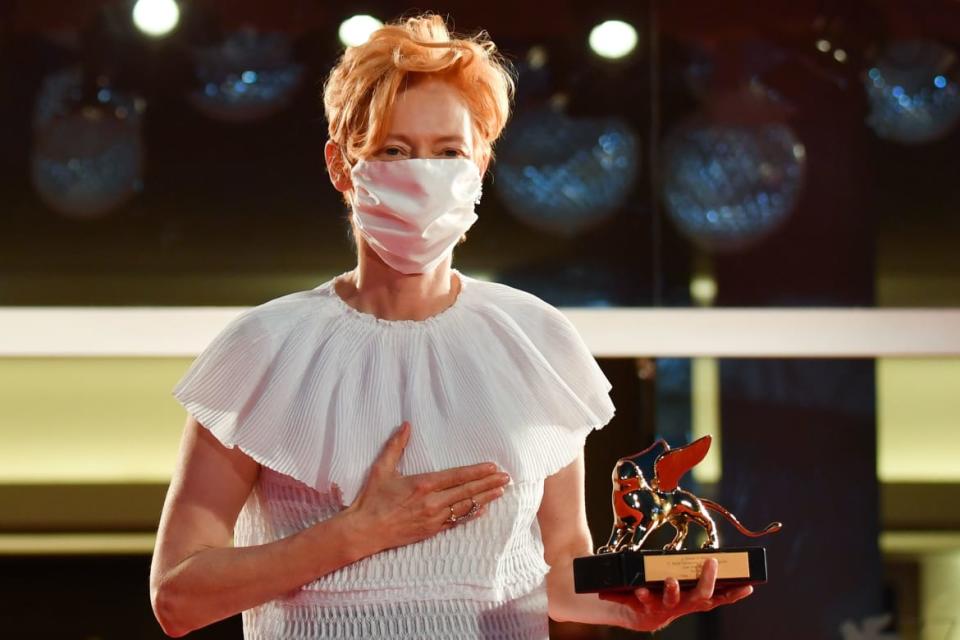 <div class="inline-image__caption"><p>Tilda Swinton poses on the red carpet after she received a Golden Lion award for Lifetime Achievement during the opening ceremony on the opening day of the 77th Venice Film Festival, on September 2, 2020 at Venice Lido.</p></div> <div class="inline-image__credit">Tiziana Fabi/AFP/Getty</div>