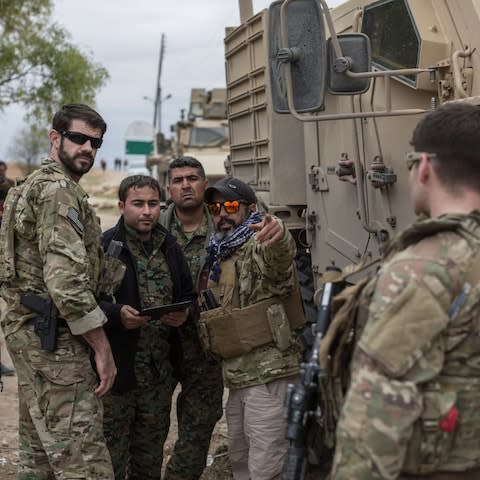 A convoy of American Special Forces and Syrian Democratic Forces fighters makes a stop during a patrol near the Turkish border in northern Syria on November 4, 2018. - Credit: Sam Tarling for the Telegraph